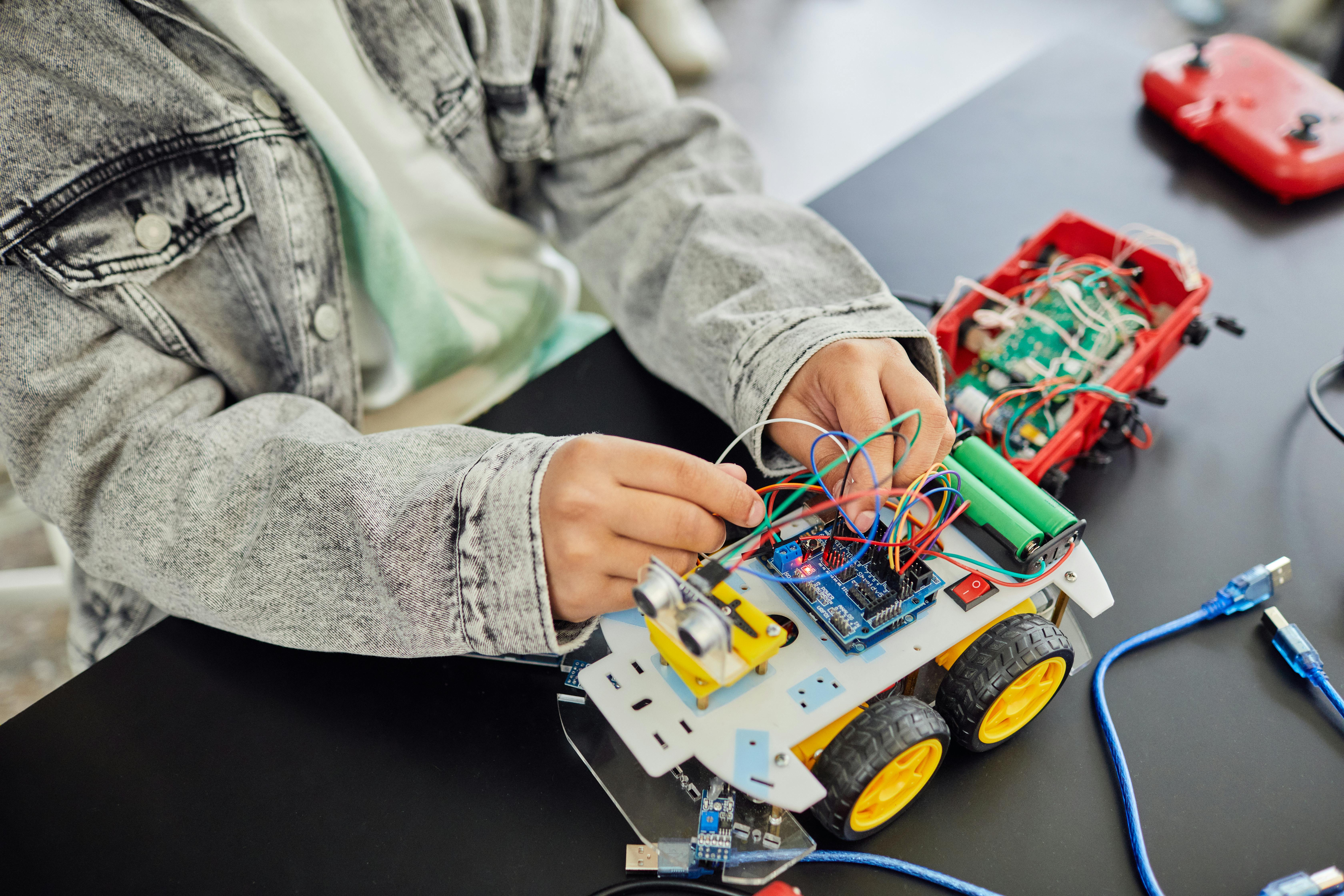 Students with desktop chatbot robots